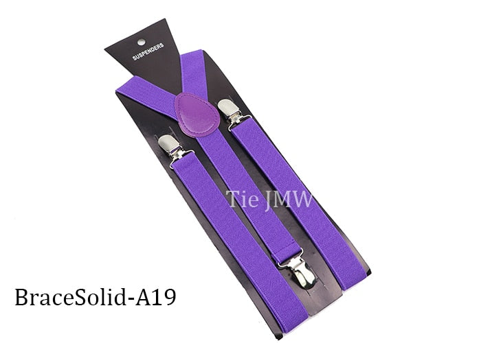 Leather Suspenders With Elastic Adjustable Straps.  Comes in a variety of solid Colors.
