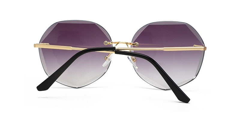 Women's rimless Gradient designer sunglasses.