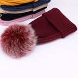 Wool/acrylic, fox fur pompom winter hats.