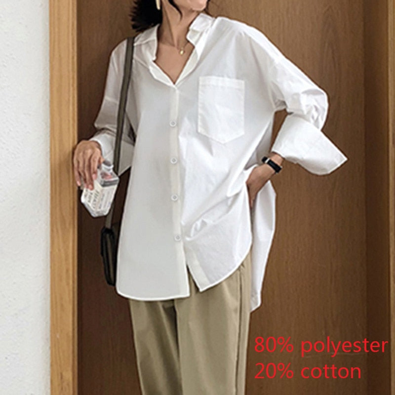 Celmia Women's Loose Fitting Long Sleeve Blouse With a Slit at the Back.