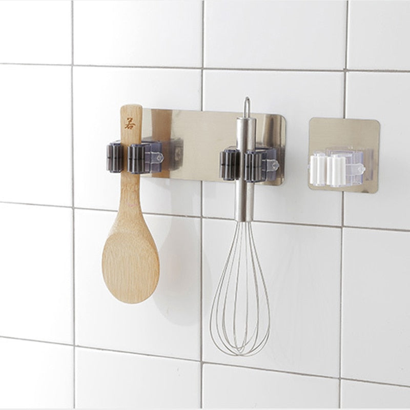 2/4pcs Adhesive wall mounted multi-purpose hooks.  Strong enough to hang brooms and mops.  Great for organizing kitchen utensils.