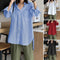 Celmia Women's Loose Fitting Long Sleeve Blouse With a Slit at the Back.