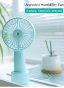 USB Rechargeable Handheld Mini cooling fan with water spray mist.