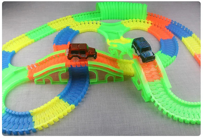 Flexible Glowing Race Track Set.  Amount Of Pieces And Number Of Cars Vary.