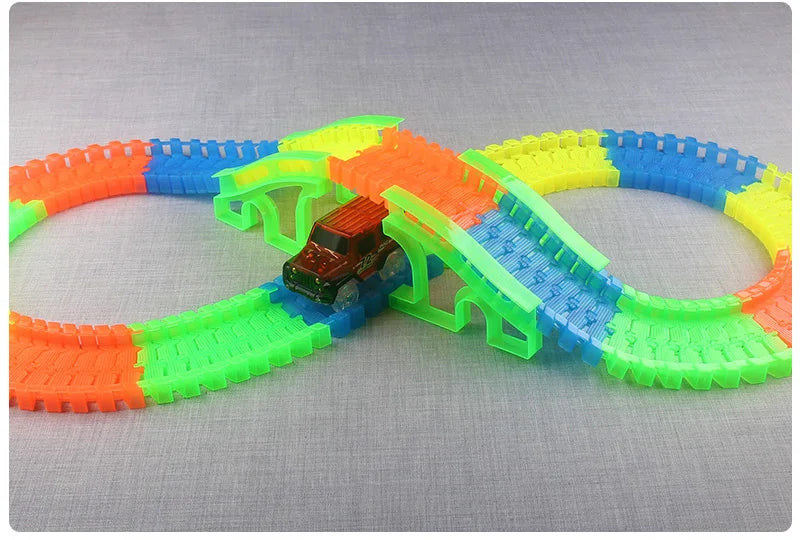 Flexible Glowing Race Track Set.  Amount Of Pieces And Number Of Cars Vary.