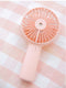 USB Rechargeable Handheld Mini cooling fan with water spray mist.