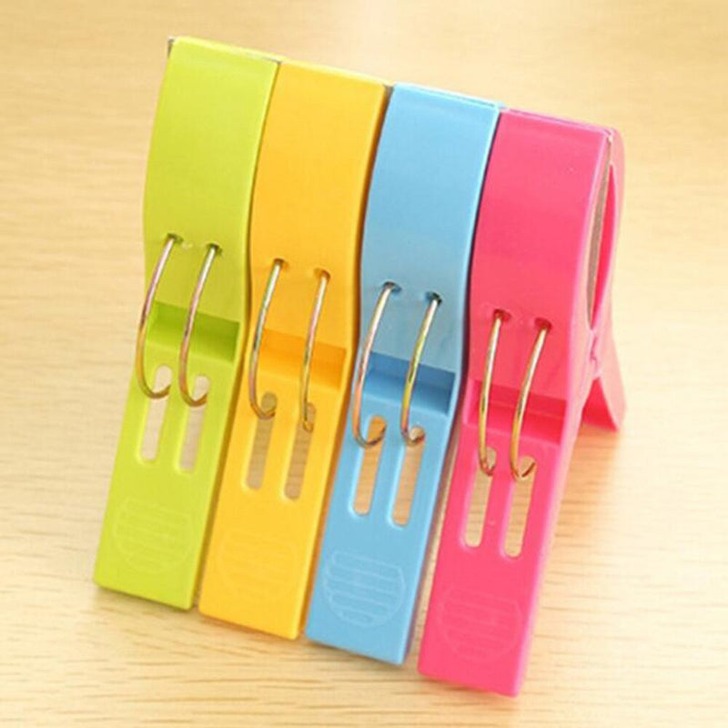 4Pcs Plastic Beach Towel Clips Or Laundry Pegs.