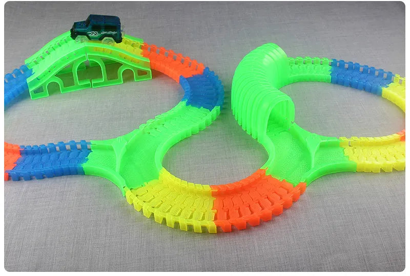 Flexible Glowing Race Track Set.  Amount Of Pieces And Number Of Cars Vary.