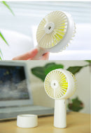 USB Rechargeable Handheld Mini cooling fan with water spray mist.