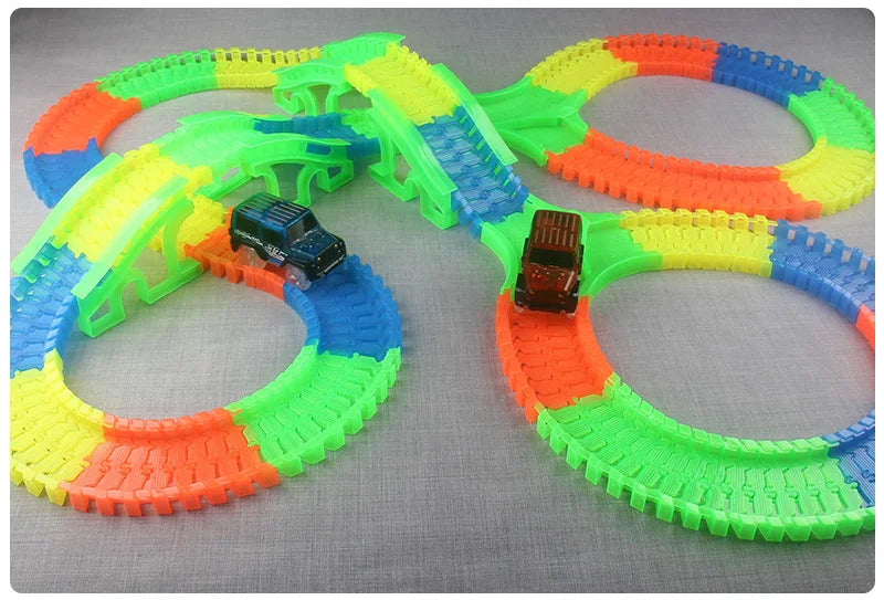 Flexible Glowing Race Track Set.  Amount Of Pieces And Number Of Cars Vary.