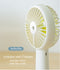 USB Rechargeable Handheld Mini cooling fan with water spray mist.