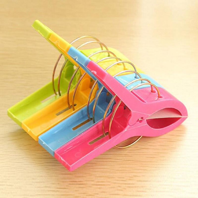 4Pcs Plastic Beach Towel Clips Or Laundry Pegs.