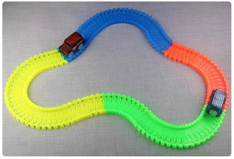 Flexible Glowing Race Track Set.  Amount Of Pieces And Number Of Cars Vary.