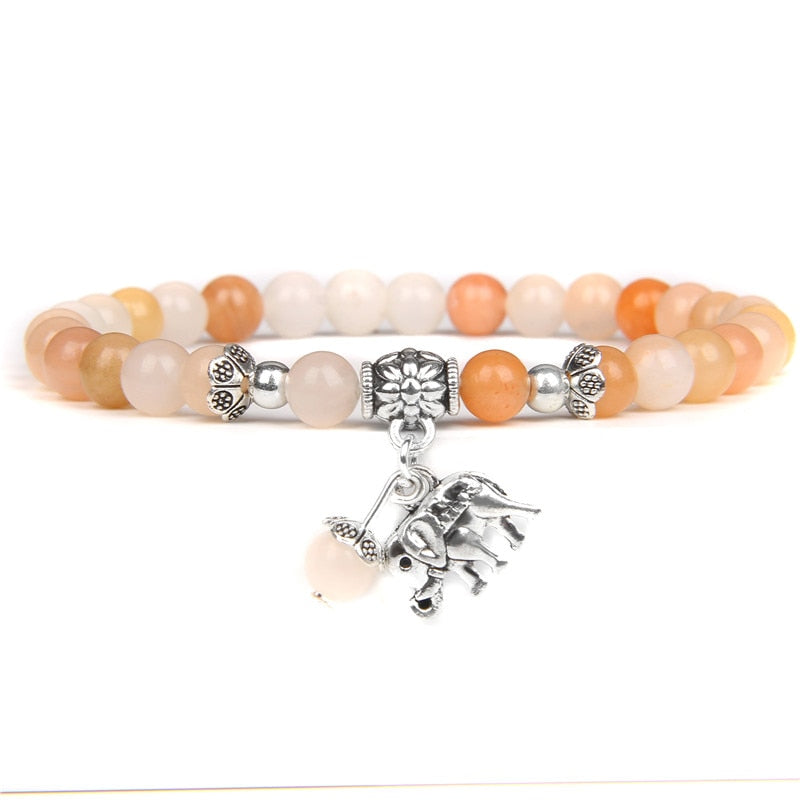 Ladies blue amazonite beaded bracelet with a metal elephant charm.
