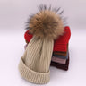 Wool/acrylic, fox fur pompom winter hats.