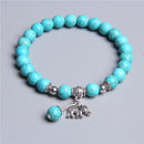 Ladies blue amazonite beaded bracelet with a metal elephant charm.