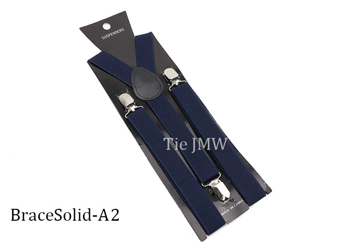 Leather Suspenders With Elastic Adjustable Straps.  Comes in a variety of solid Colors.