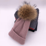 Wool/acrylic, fox fur pompom winter hats.