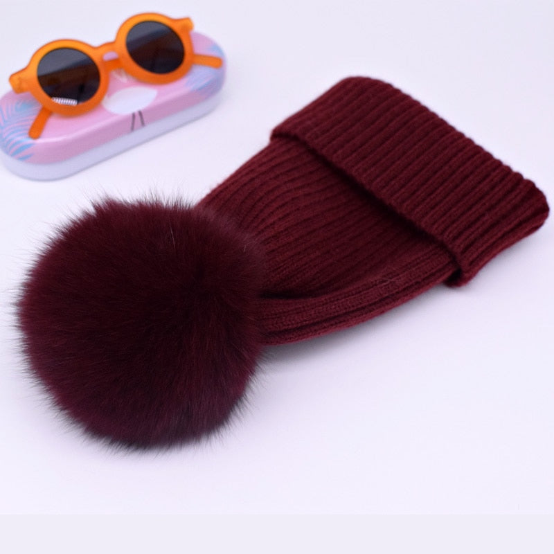 Wool/acrylic, fox fur pompom winter hats.