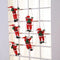 Christmas Decoration Of Santa Claus Climbing on A Rope Ladder.