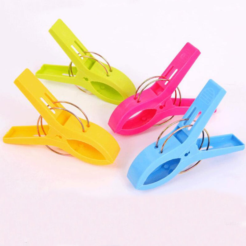 4Pcs Plastic Beach Towel Clips Or Laundry Pegs.