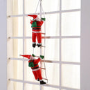 Christmas Decoration Of Santa Claus Climbing on A Rope Ladder.