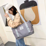 Women's AOTTLA casual handbag/carry on luggage bag for traveling.  Double zipper on bottom to expand bag..